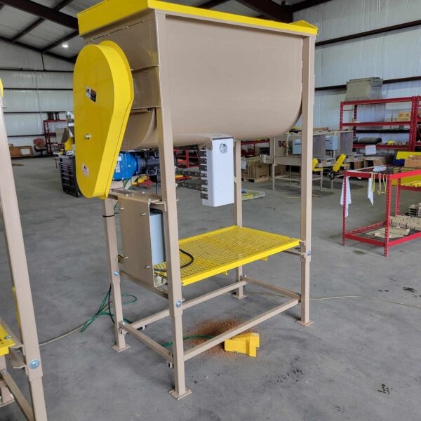Industrial seed cleaner with a yellow and beige structure