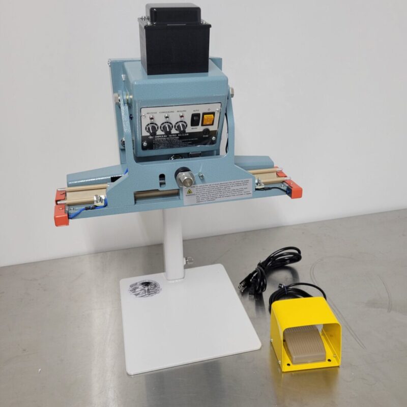 A small 120v 18" 10mm Impulse Sealer Dual Element Pedal Operated and Stand with a yellow box on top.