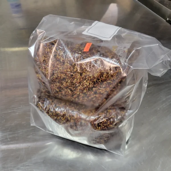 A bag of nuts sitting on top of a counter.