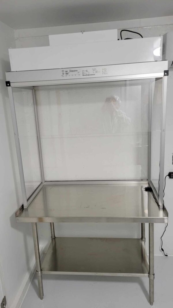 A Vertical Flow Cabinet 2x4 ft Flowhood Fan Filter Unit New 120V *Freight Not Included* with a glass cover.