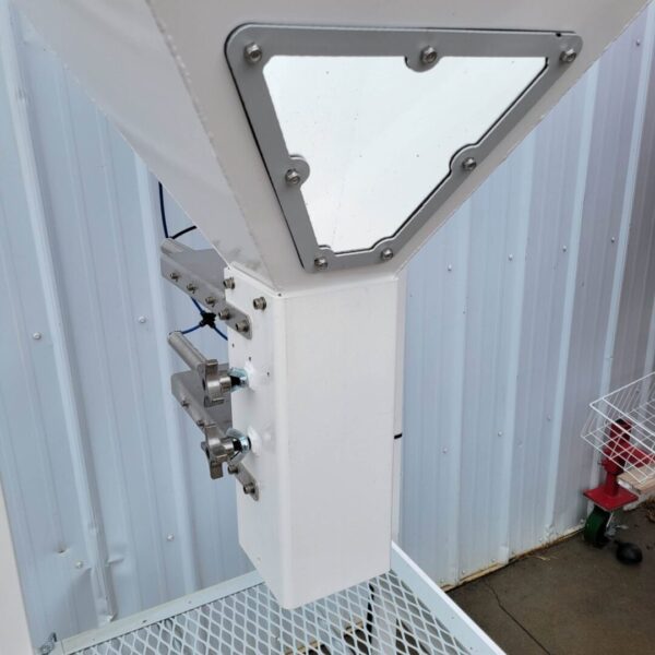 A white Spawn Bagging Machine with a metal basket attached to it.