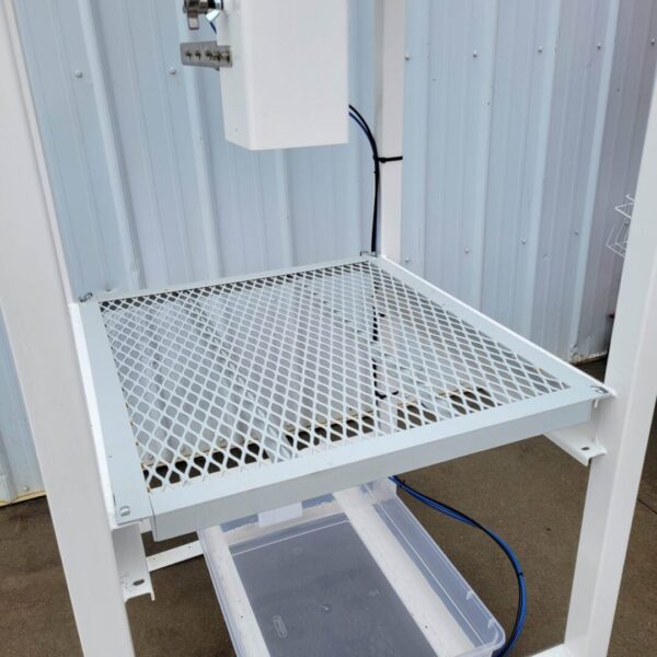 A white Spawn Bagging Machine with a basket on top of it.