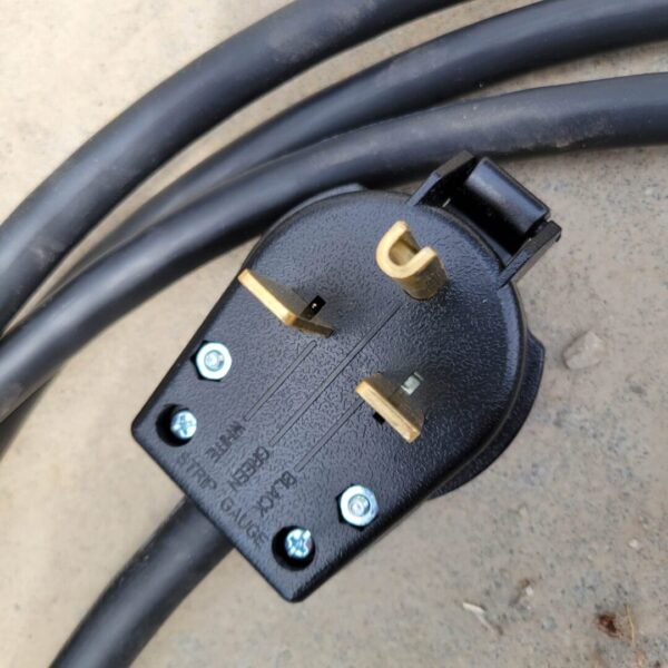 A close up of a black Stainless Steel Grain Spawn Tank with two plugs.
