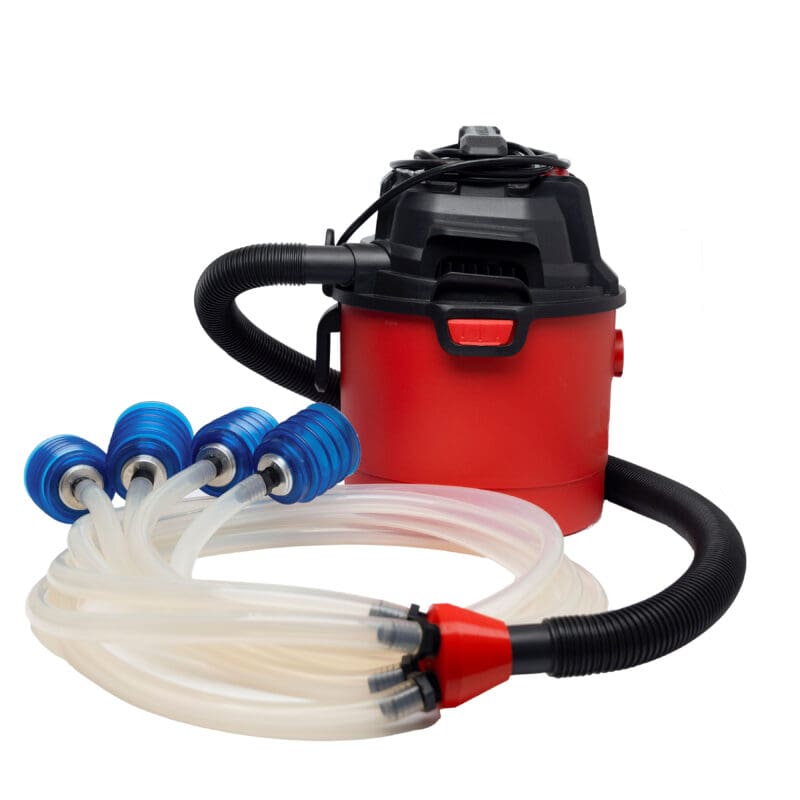Red water pump with multiple hoses attached.